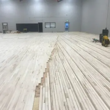 Installing sports hardwood flooring gymnasium