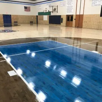 Blue hardwood basketball court flooring