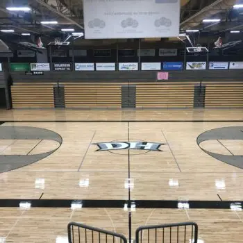 Polished indoor basketball court flooring