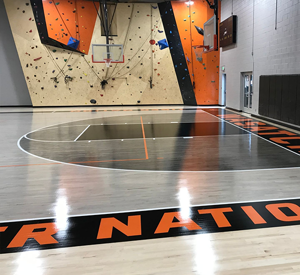 Indoor gymnasium hardwood basketball court