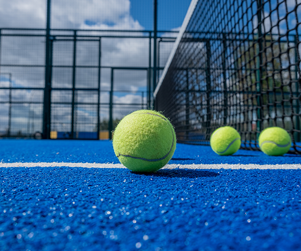 Blue tennis court with balls