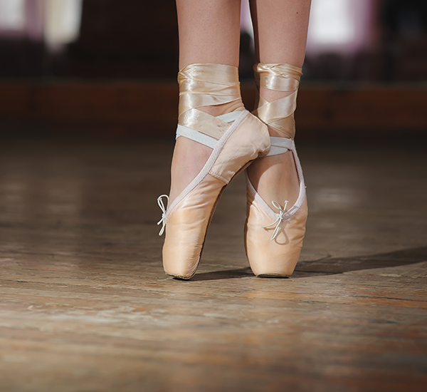 Ballet shoes on hardwood floor